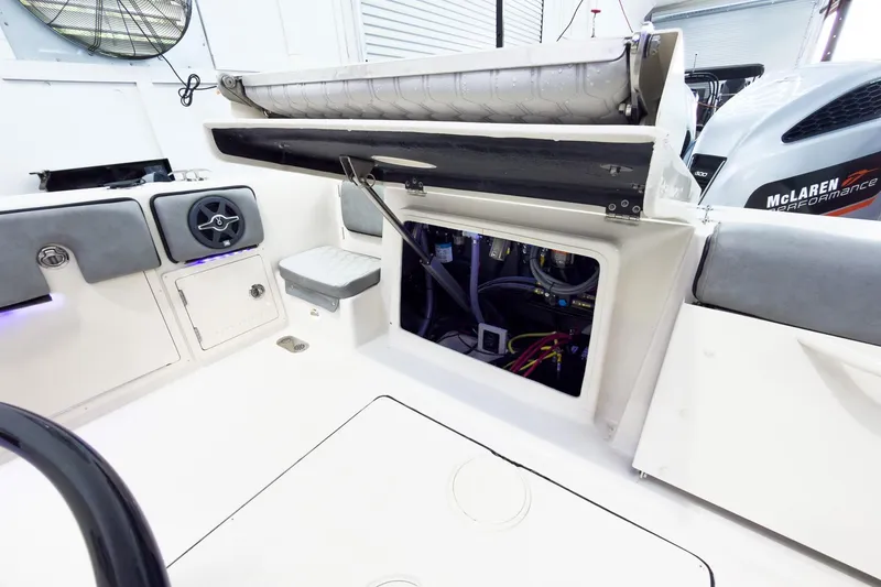 Slide: The Image of Interior view of a 2026 Sea Chaser 27 HFC CC boat, showcasing storage and engine access. - 18