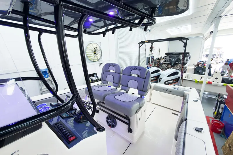 Slide: The Image of Interior view of 2026 Sea Chaser 27 HFC CC boat in a workshop setting. - 26