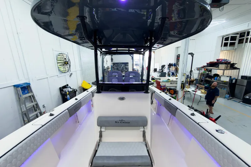 Slide: The Image of 2026 Sea Chaser 27 HFC CC boat interior in a workshop setting. - 29