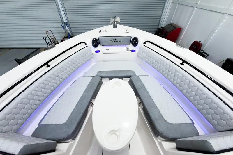 Slide: The Image of 2026 Sea Chaser 27 HFC CC boat interior with luxurious seating and ambient lighting. - 35