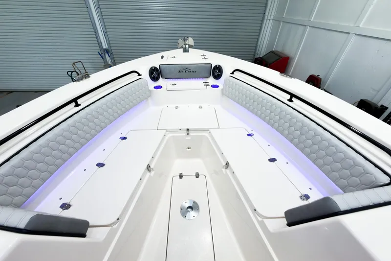 Slide: The Image of 2026 Sea Chaser 27 HFC CC boat interior with cushioned seating and modern design. - 38