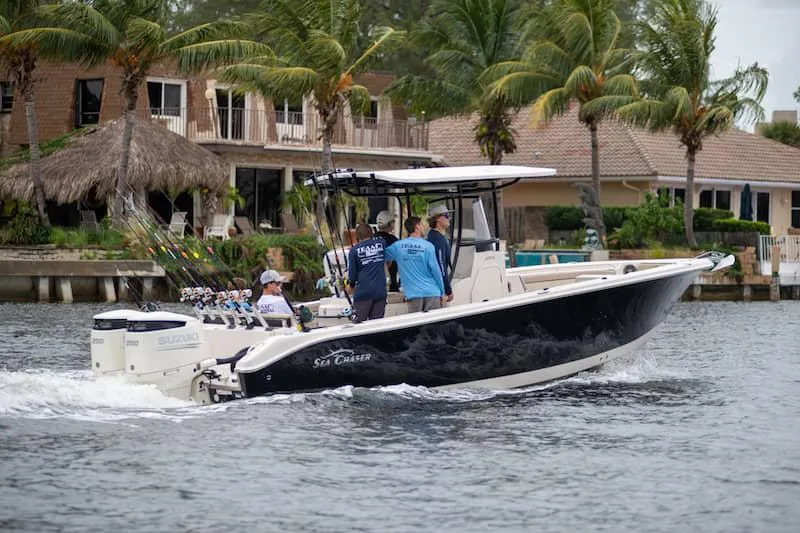 Slide: The Image of Manufacturer Provided Image: 2026 Sea Chaser 27 HFC CC boat cruising near waterfront homes. - 42