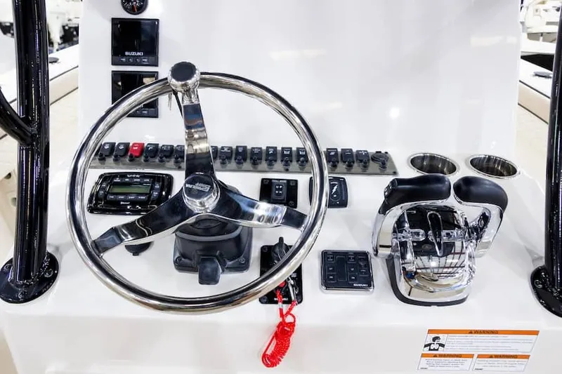 Slide: The Image of Manufacturer Provided Image: 2026 Sea Chaser 27 HFC CC helm with controls and steering wheel. - 6
