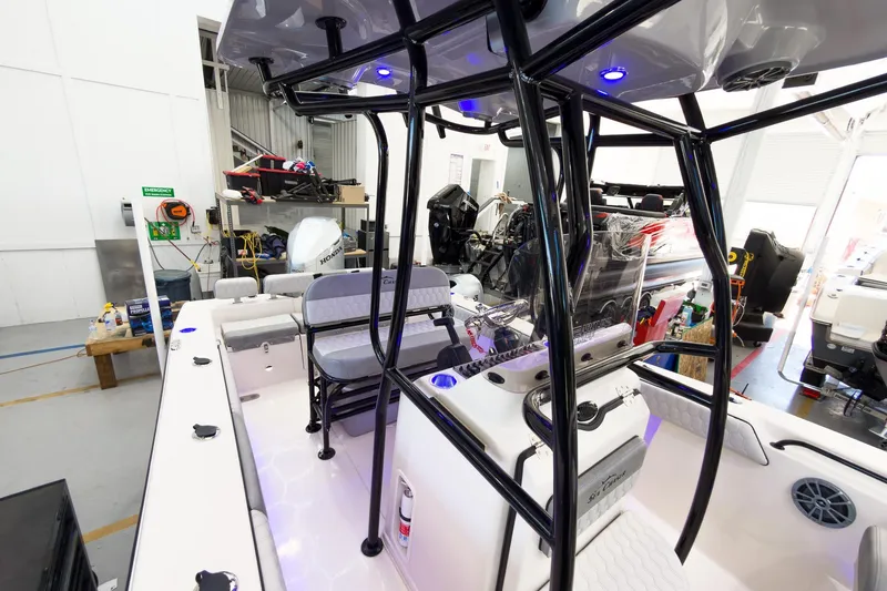 Slide: The Image of Interior view of a 2026 Sea Chaser 22 HFC boat in a workshop setting. - 12