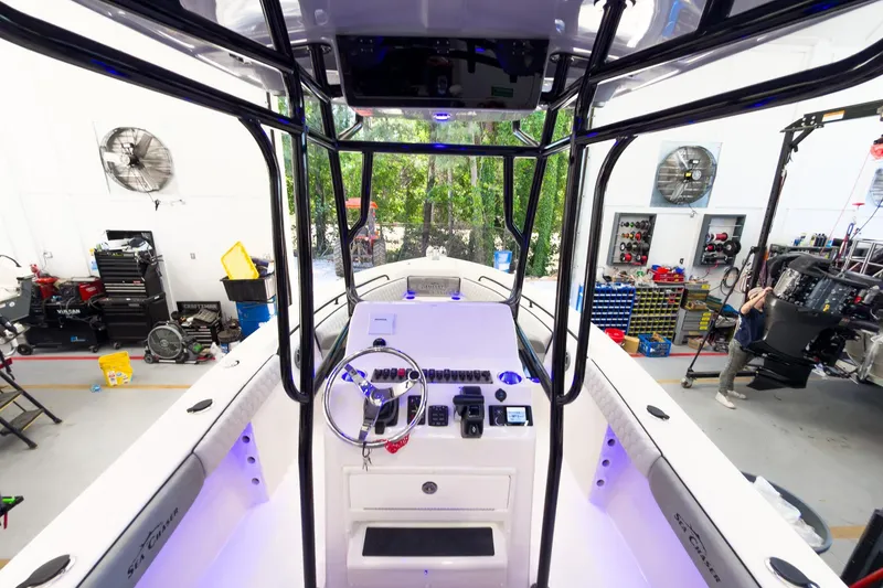 Slide: The Image of Interior view of 2026 Sea Chaser 22 HFC boat in a workshop setting. - 15