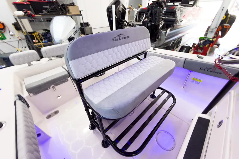 Slide: The Image of 2026 Sea Chaser 22 HFC boat interior with cushioned seating and modern design. - 20