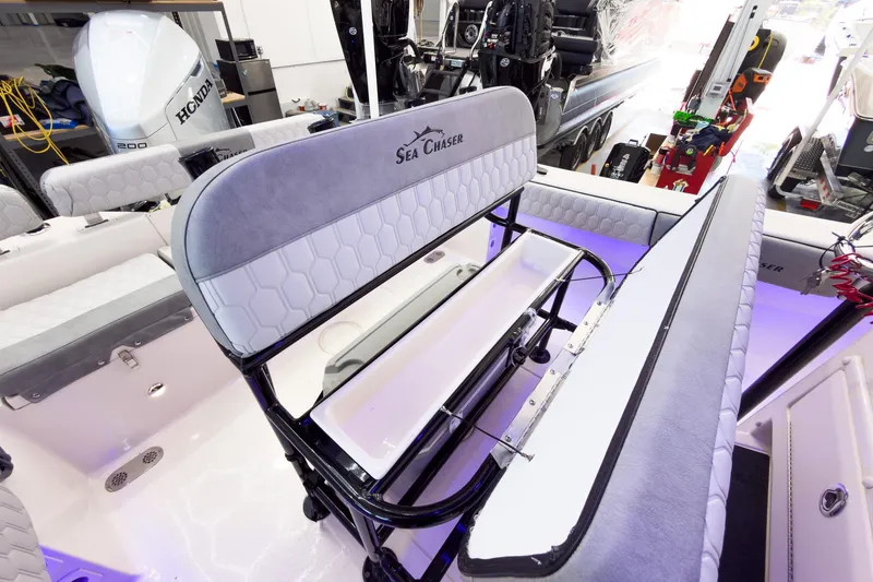 Slide: The Image of 2026 Sea Chaser 22 HFC boat interior with seating and storage features. - 21