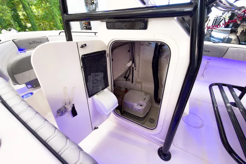 Slide: The Image of 2026 Sea Chaser 22 HFC boat interior with storage compartment and seating. - 29
