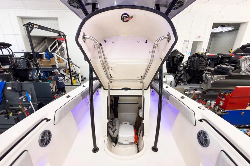 Slide: The Image of 2026 Sea Chaser 22 HFC boat interior with open hatch and visible equipment. - 31