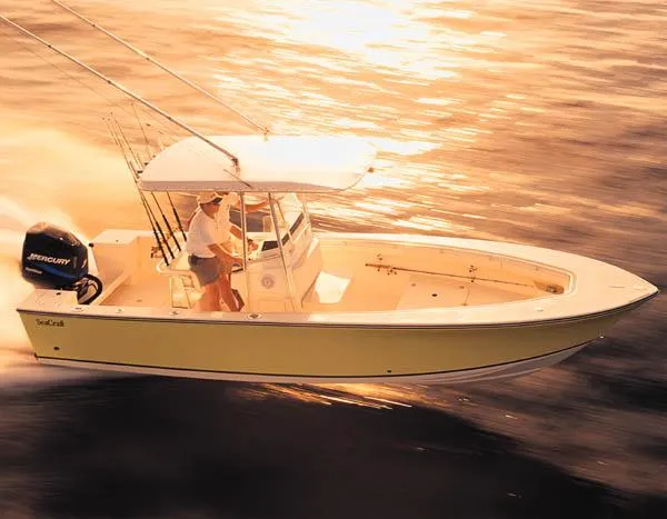 Slide: The Image of 2007 SeaCraft SC 23 Classic boat interior with seating and storage, docked among other boats. - 14