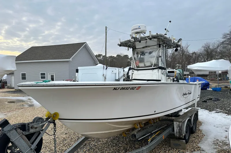 Slide: The Image of 2007 SeaCraft SC 23 Classic boat on trailer, parked outdoors near a house. - 18