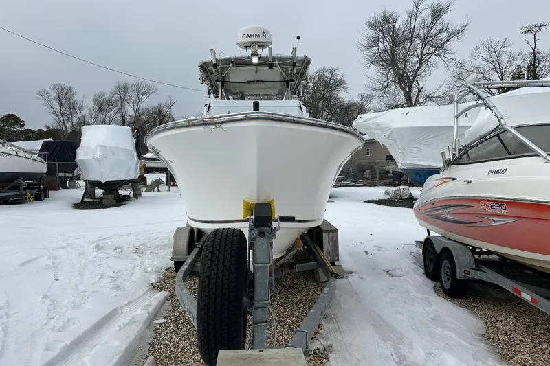 Slide: The Image of 2007 SeaCraft SC 23 Classic boat interior with fishing gear and Suzuki engine. - 3