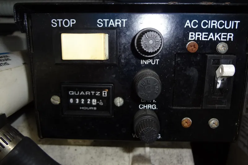 Slide: The Image of Control panel of a 2002 Sea Ray Sundancer 280 with hour meter and circuit breaker. - 43