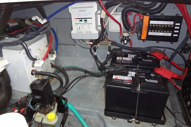 Slide: The Image of Electrical system of a 2002 Sea Ray Sundancer 280 with batteries and wiring. - 44