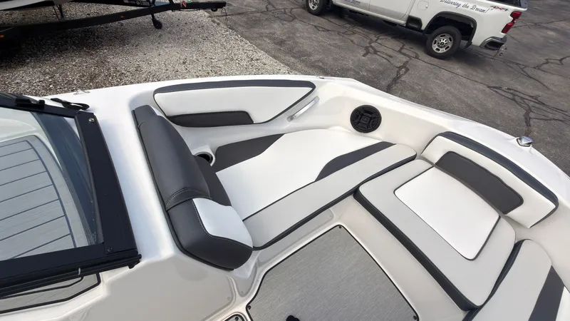 Slide: The Image of The image shows the interior of a Yamaha SX195 boat with modern, cushioned seating. - 35