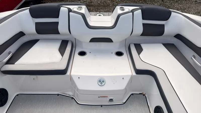 Slide: The Image of The image shows the interior of a Yamaha SX195 boat with white and gray seating. - 10