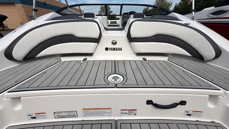 Slide: The Image of Rear view of a Yamaha SX195 boat with gray cushions and teak-style decking. - 4