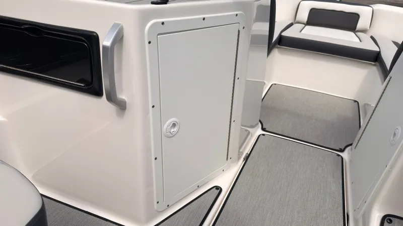 Slide: The Image of The image shows the interior of a Yamaha SX195 boat with gray upholstery and a storage compartment. - 20