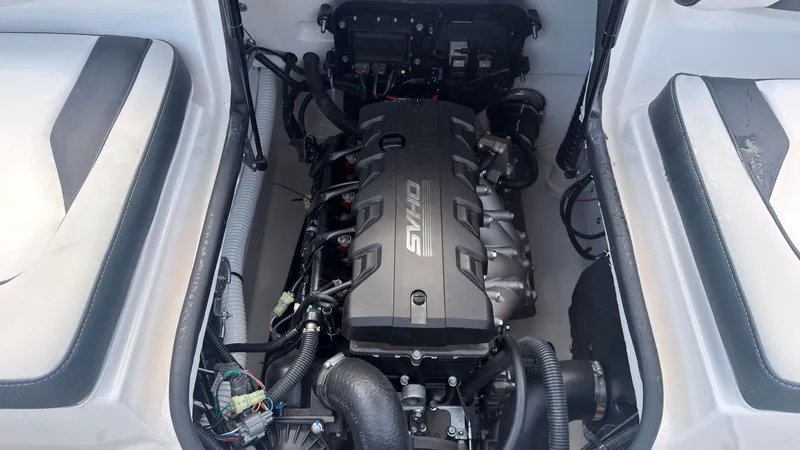 Slide: The Image of The engine compartment of a 2026 Yamaha SX195 boat with a powerful engine and wiring. - 12