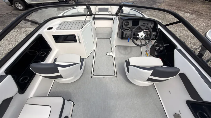 Slide: The Image of The image shows the cockpit of a Yamaha SX195 boat with modern seating and a sleek dashboard. - 16