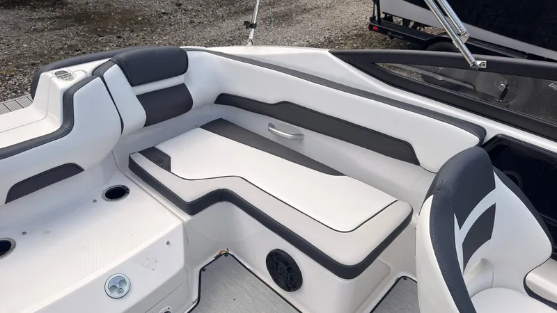 Slide: The Image of The image shows the interior of a Yamaha SX195 boat with gray and white seating. - 13