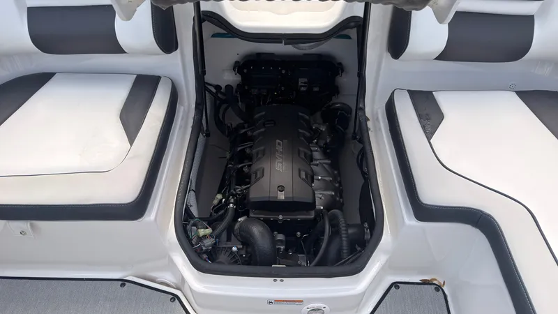 Slide: The Image of The engine compartment of a Yamaha SX195 boat with a modern engine. - 11