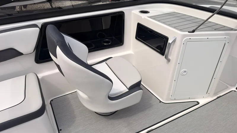 Slide: The Image of The interior of a 2026 Yamaha SX195 boat with a swivel seat and storage compartments. - 17