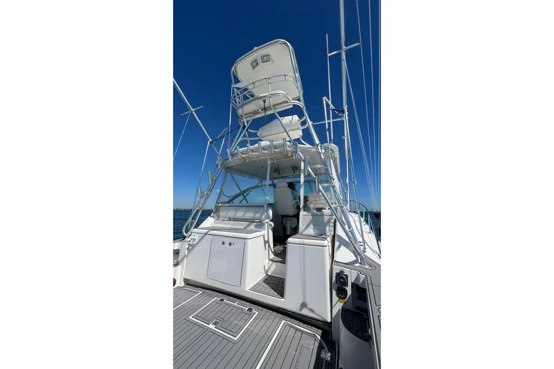 Slide: The Image of 2005 Rampage 38 Express boat with tower, viewed from the deck under clear blue sky. - 14