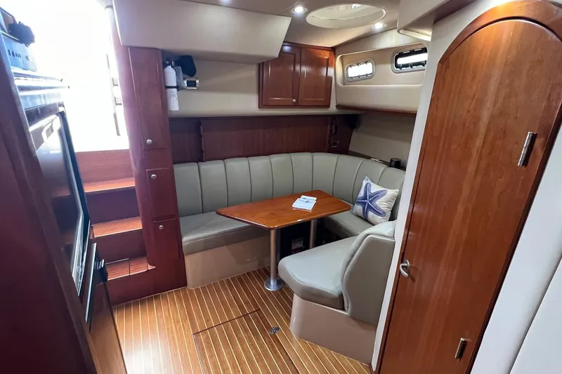Slide: The Image of Luxurious interior of 2005 Rampage 38 Express yacht with wood finishes and cozy seating. - 20