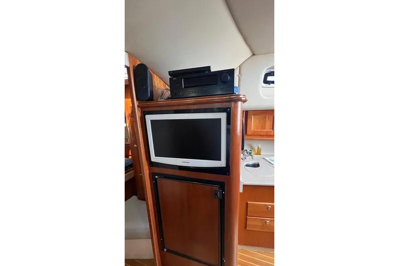 Slide: The Image of 2005 Rampage 38 Express interior with TV, stereo, and wooden cabinetry. - 29