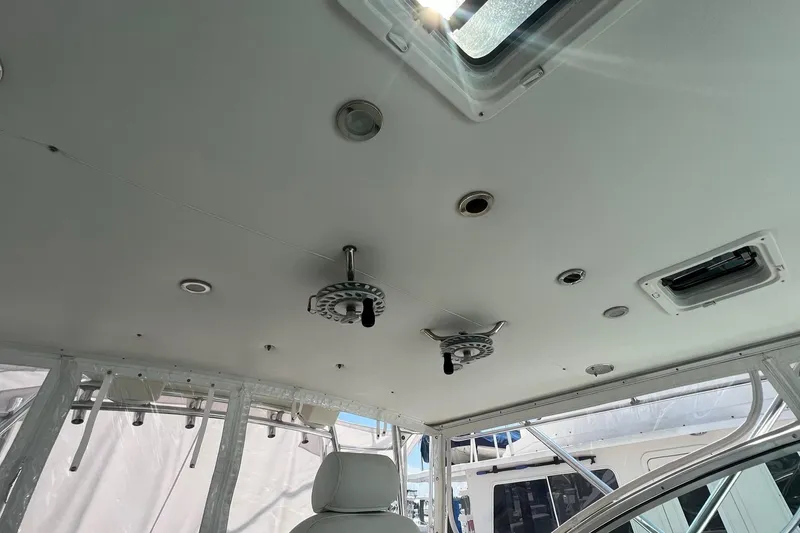 Slide: The Image of Interior view of 2005 Rampage 38 Express boat ceiling with hatches and fixtures. - 35