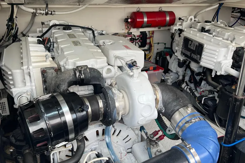 Slide: The Image of Engine room of a 2005 Rampage 38 Express boat, featuring CAT marine power systems. - 43