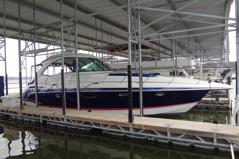 Slide: The Image of 2010 Formula 45 Yacht cruising on a sunny day with American flag. - 1