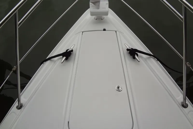 Slide: The Image of 2010 Formula 45 Yacht cruising on a serene lake under a clear blue sky. - 10