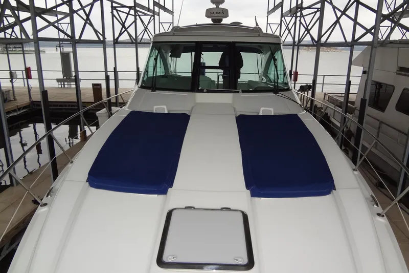 Slide: The Image of 2010 Formula 45 Yacht cruising on a sunny day, blue and white design. - 12