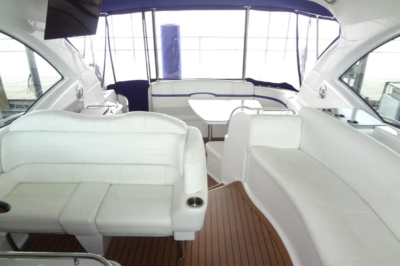 Slide: The Image of 2010 Formula 45 Yacht in marina, sleek design with blue and red accents. - 16