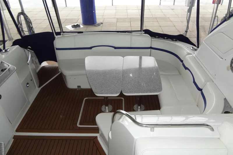 Slide: The Image of 2010 Formula 45 Yacht docked, featuring sleek design and wooden deck in Austin, TX marina. - 18