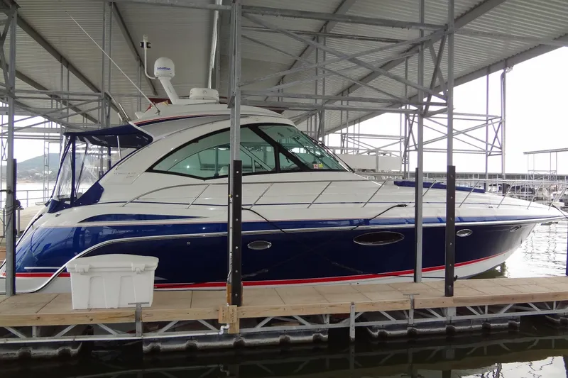 Slide: The Image of 2010 Formula 45 Yacht on calm water under clear blue sky. - 2