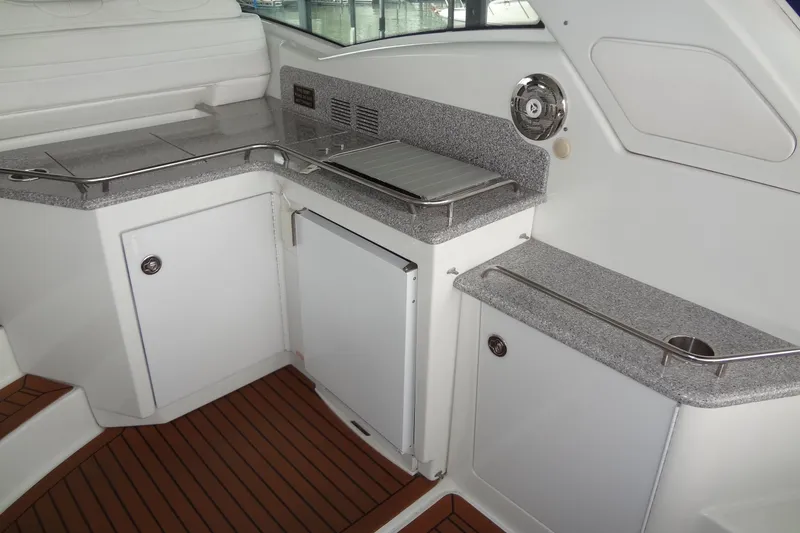 Slide: The Image of 2010 Formula 45 Yacht deck with blue sun pads, docked at marina. - 22