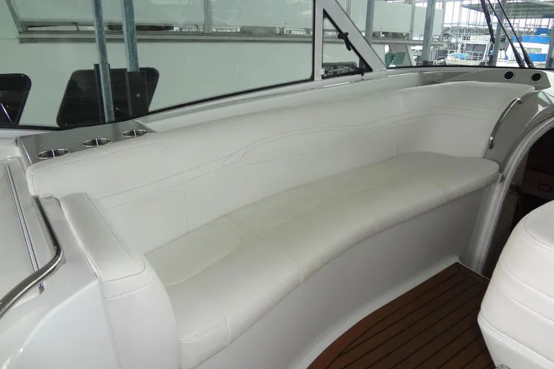 Slide: The Image of Luxurious interior of a 2010 Formula 45 Yacht with white seating and wood flooring. - 29