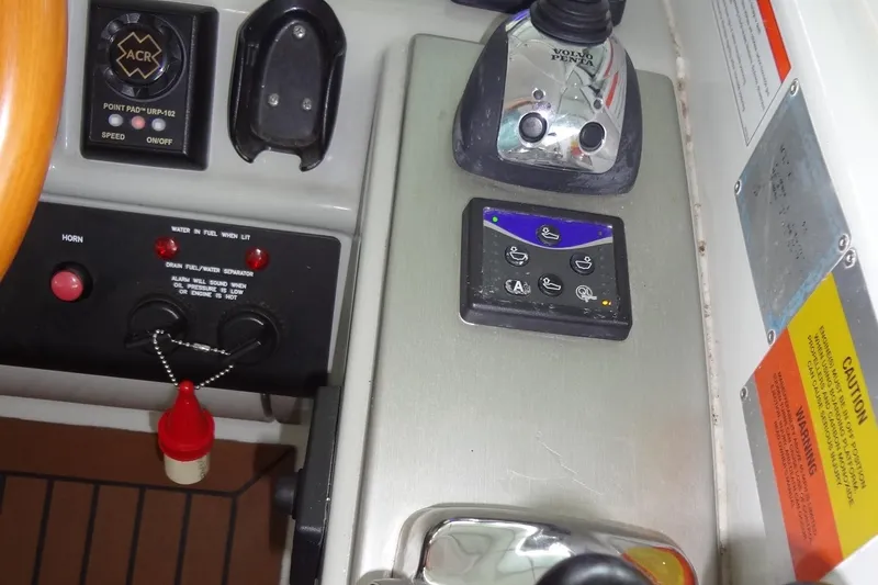 Slide: The Image of Open mini fridge on 2010 Formula 45 Yacht, stocked with beverages on wooden flooring. - 38