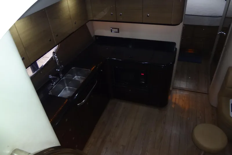 Slide: The Image of 2010 Formula 45 Yacht kitchenette with granite countertop and sink. - 39