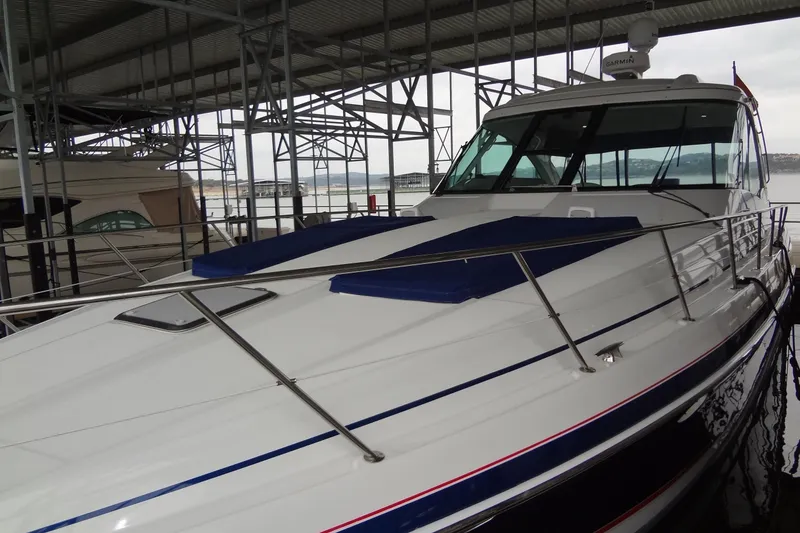 Slide: The Image of 2010 Formula 45 Yacht on serene lake under clear blue sky. - 4