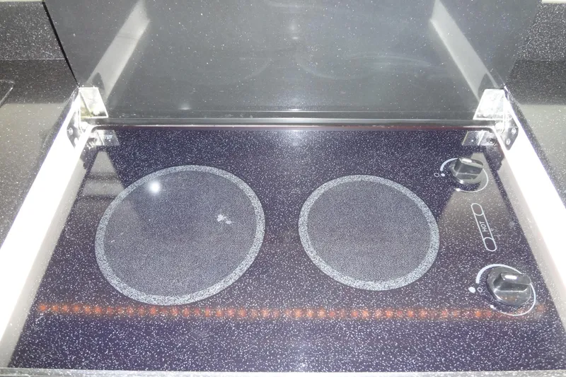 Slide: The Image of Cockpit of 2010 Formula 45 Yacht with modern controls and white seating. - 43