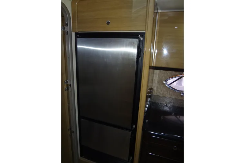 Slide: The Image of Luxurious white seating on 2010 Formula 45 Yacht, featuring cup holders and sleek design. - 44