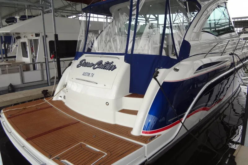 Slide: The Image of 2010 Formula 45 Yacht on water, sleek design, blue and white exterior. - 5