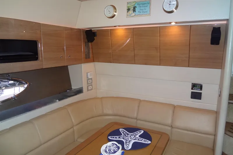 Slide: The Image of Interior of 2010 Formula 45 Yacht kitchen with modern amenities and wooden cabinetry. - 52