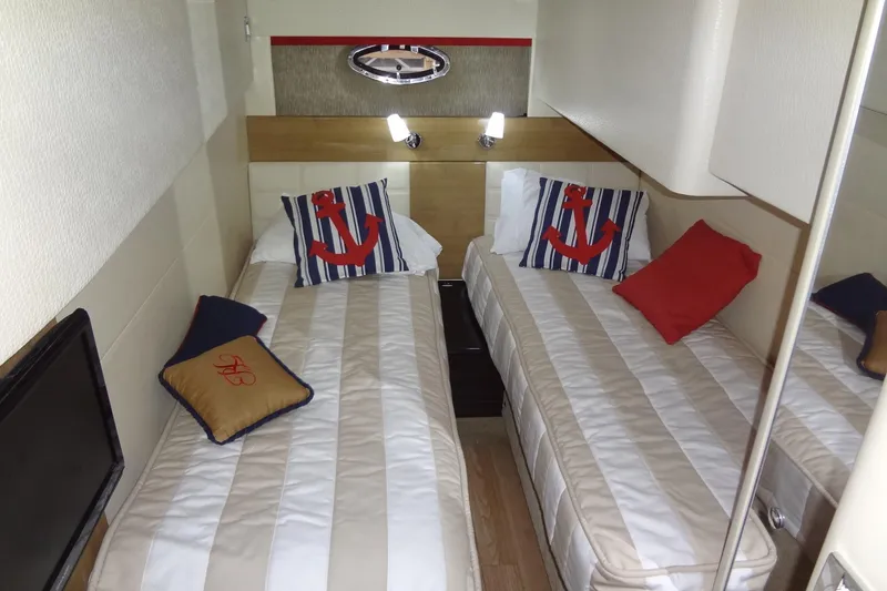 Slide: The Image of Modern kitchen area in a 2010 Formula 45 Yacht with sleek black countertop. - 55