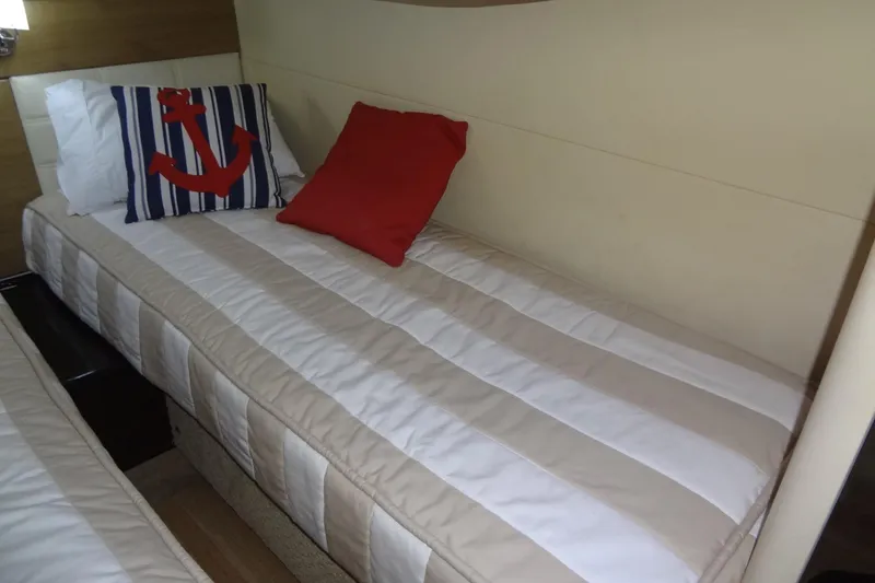 Slide: The Image of Interior of 2010 Formula 45 Yacht featuring stainless steel refrigerator and wooden cabinetry. - 57