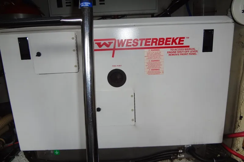 Slide: The Image of Luxurious interior of 2010 Formula 45 Yacht with beige seating and wooden cabinets. - 65